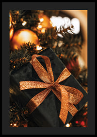 Close-up of black Christmas present with glittery ribbon among the branches of the fir tree-4