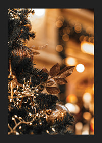 Close-up of fir tree with golden decorations and warm lights-5