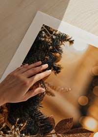 Close-up of fir tree with golden decorations and warm lights-9