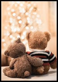 Two teddy bears from behind against bright Christmas tree, soft colors-6