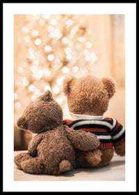 Two teddy bears from behind against bright Christmas tree, soft colors-0