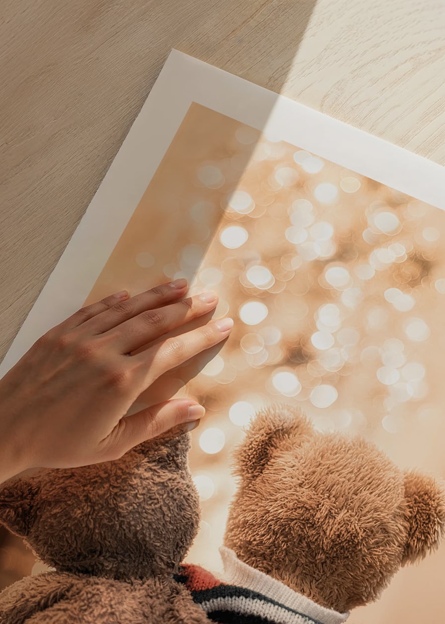 Two teddy bears from behind against bright Christmas tree, soft colors-12