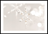Close-up of sparkling crystal snowflake decoration against light background-0