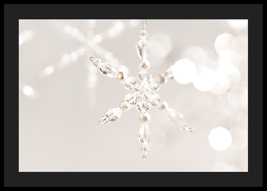 Close-up of sparkling crystal snowflake decoration against light background-12