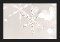 Close-up of sparkling crystal snowflake decoration against light background-5