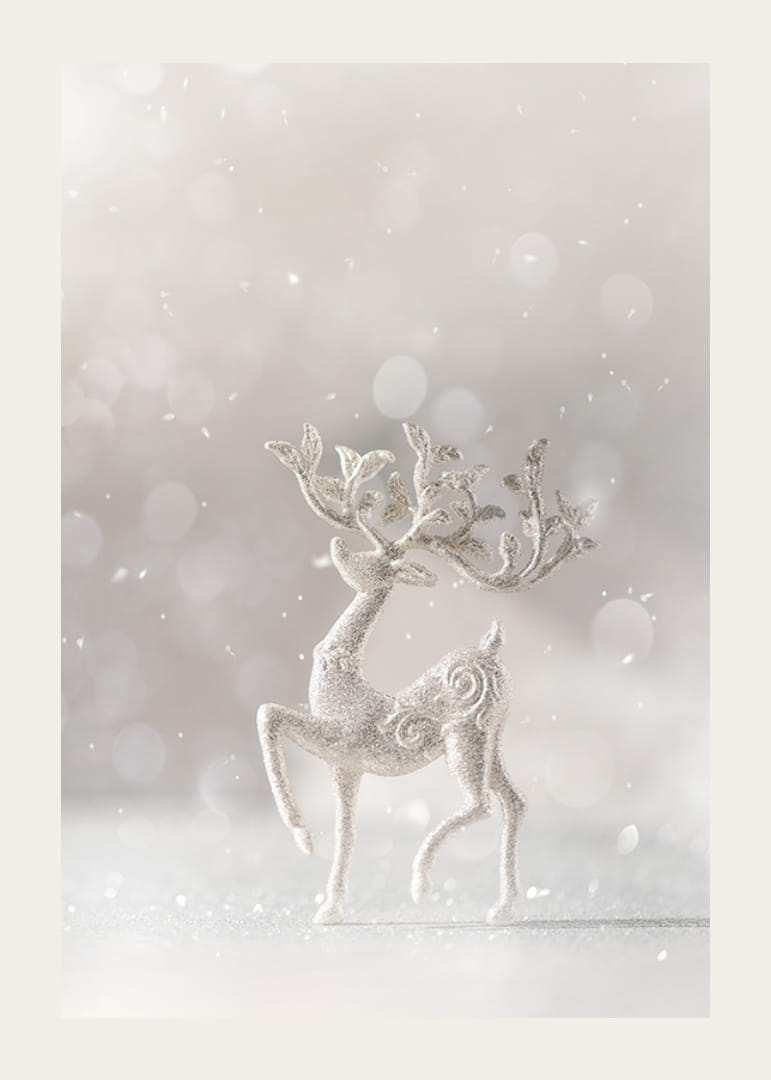 Glittering decorative deer in silver against light blurred background-12