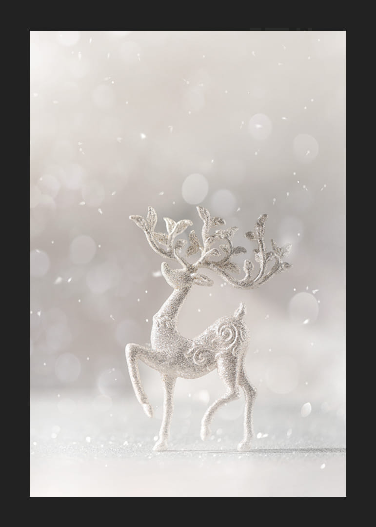 Glittering decorative deer in silver against light blurred background-12