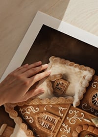 Watercolor of detailed gingerbread house with snow and decorations-9