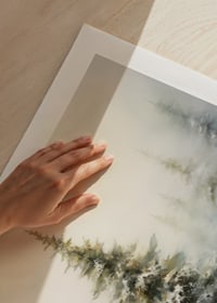 Watercolor painting of snow-covered fir tree against light, foggy winter background-9