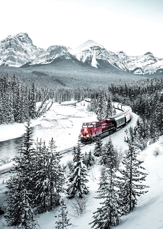 Photographic winter landscape with red train among snow-covered fir trees-12
