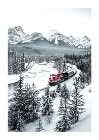 Photographic winter landscape with red train among snow-covered fir trees-1