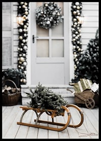 Photograph of fir tree on wooden sled in front of decorated door-6