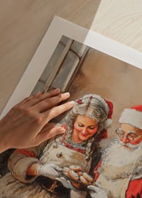 Illustration of Santa Claus and Mrs. Claus baking cookies-9