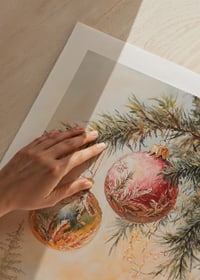 Painted Christmas tree branch with three balls in red and green-9