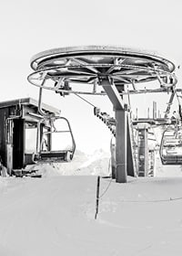 Black and white ski lift station in winter landscape with snow-covered details-7