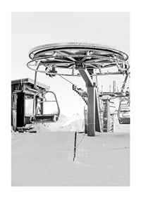 Black and white ski lift station in winter landscape with snow-covered details-1