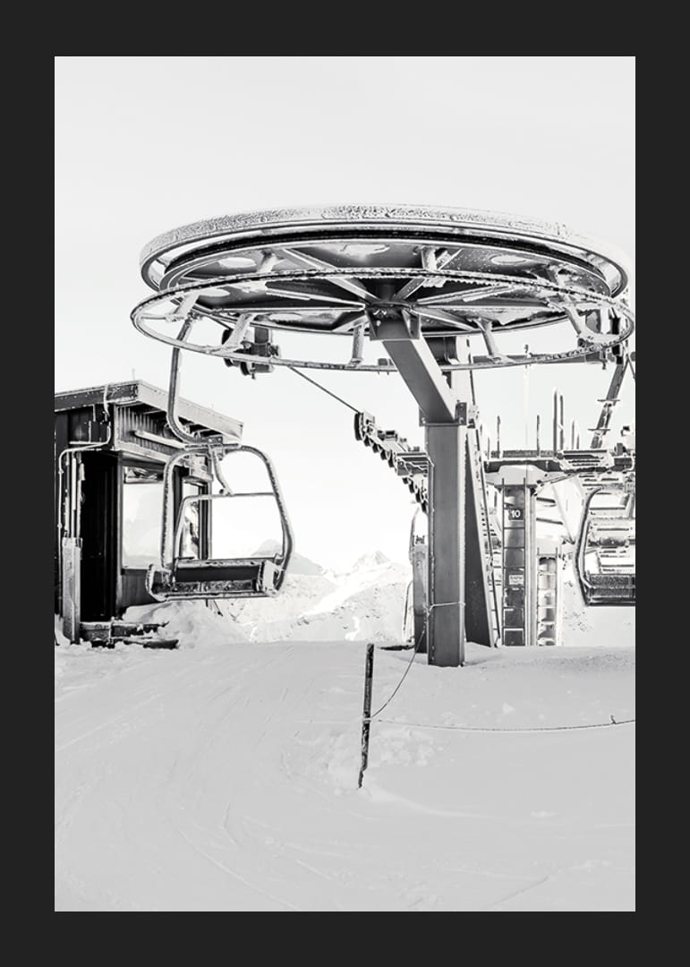 Black and white ski lift station in winter landscape with snow-covered details-12