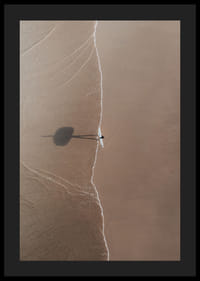 Aerial view of lone surfer with board on sandy beach-4