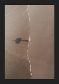 Aerial view of lone surfer with board on sandy beach-5