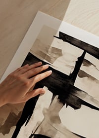 Abstract black brush strokes against beige watercolor background-9