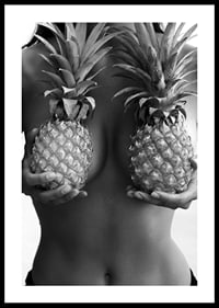 Black and white photo of woman holding two pineapples to her chest-0
