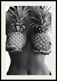 Black and white photo of woman holding two pineapples to her chest-2