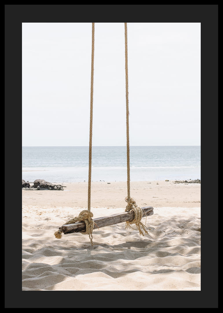 Photograph of wooden swing on light sandy beach by the sea-12