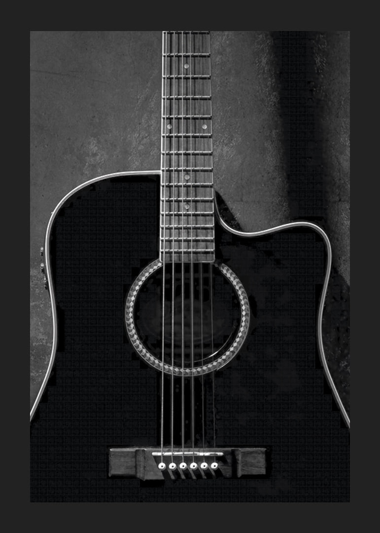 Black and white close-up of acoustic guitar against concrete background-12