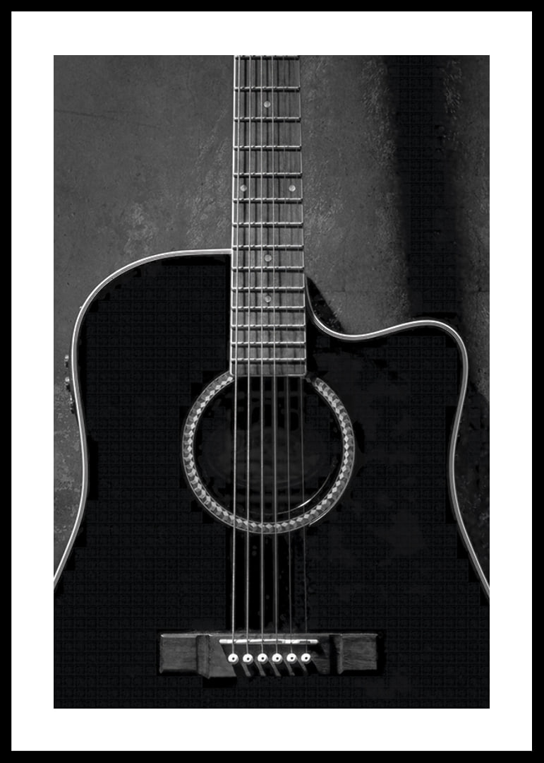 Black and white close-up of acoustic guitar against concrete background-12