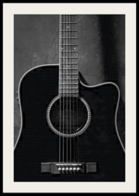 Black and white close-up of acoustic guitar against concrete background-4