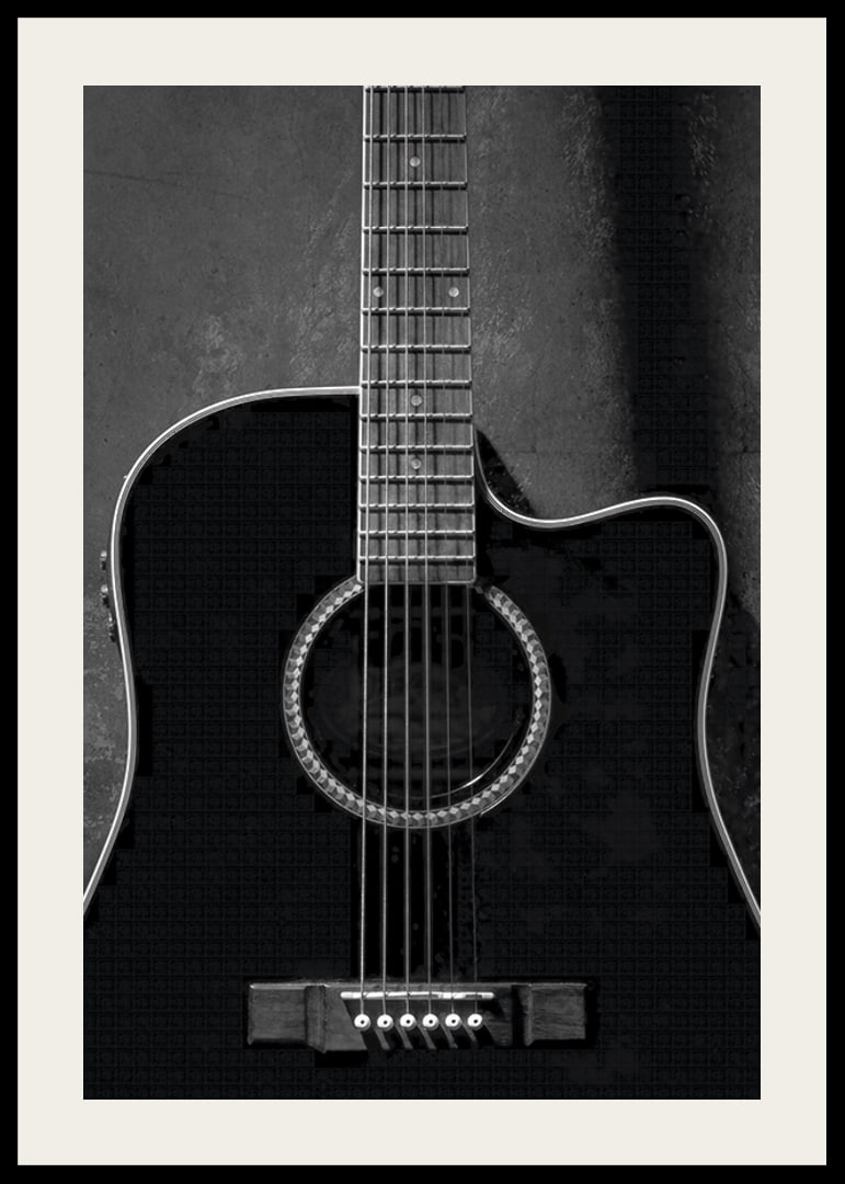 Black and white close-up of acoustic guitar against concrete background-12
