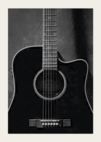 Black and white close-up of acoustic guitar against concrete background-5