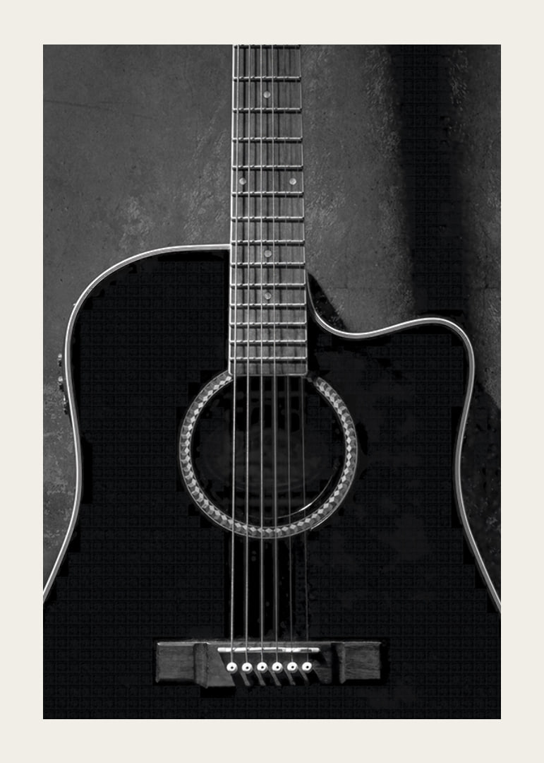 Black and white close-up of acoustic guitar against concrete background-12