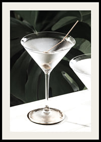 Photographic close-up of martini glass with olive and iced surface-2