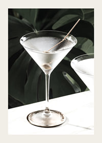 Photographic close-up of martini glass with olive and iced surface-3