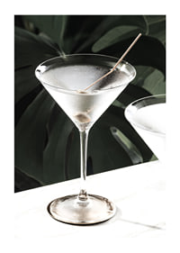 Photographic close-up of martini glass with olive and iced surface-1