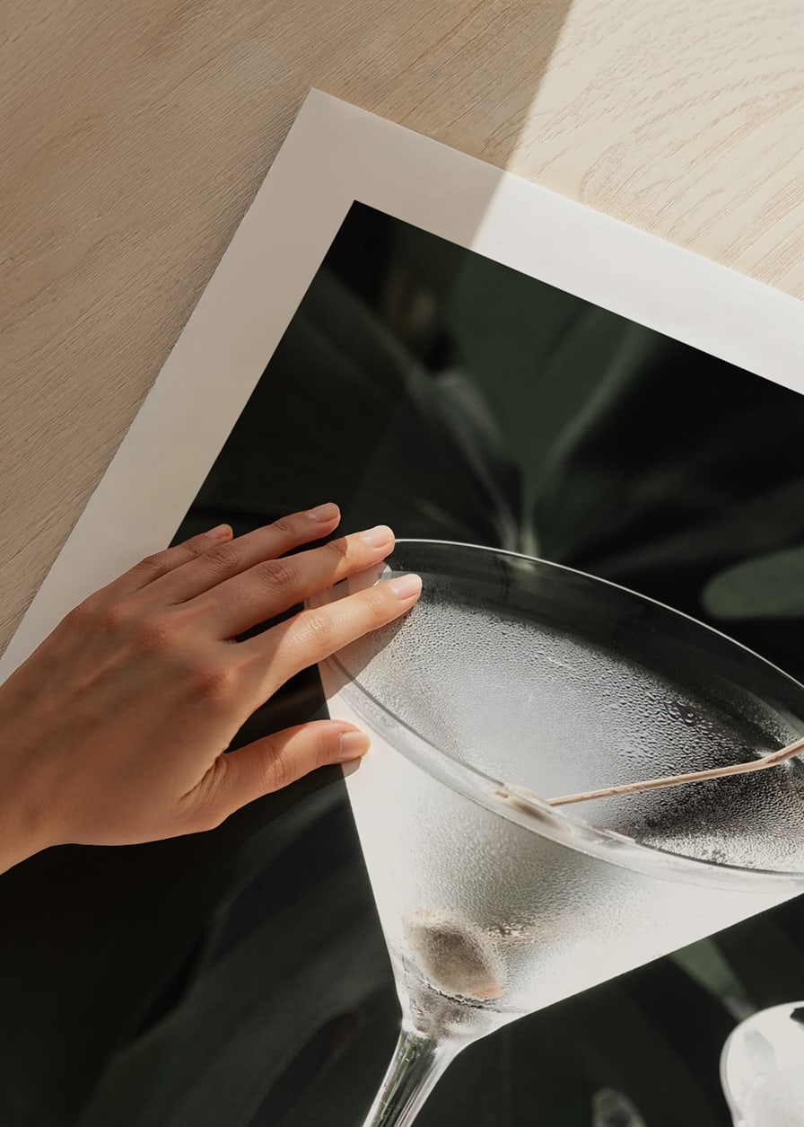 Photographic close-up of martini glass with olive and iced surface-12