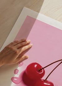 Two red cocktail berries with stems on glossy pink surface-9