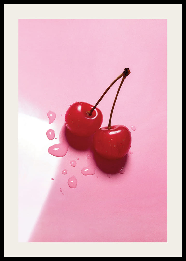 Två röda cocktailbär med stjälkar på blank rosa yta-12