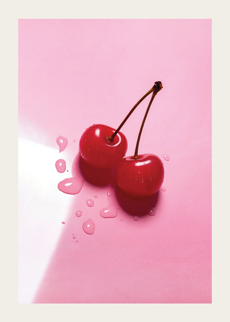 Two red cocktail berries with stems on glossy pink surface-12