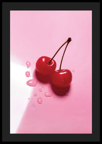 Två röda cocktailbär med stjälkar på blank rosa yta-4