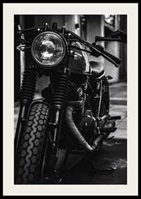 Black and white close-up of classic motorcycle in urban environment-4
