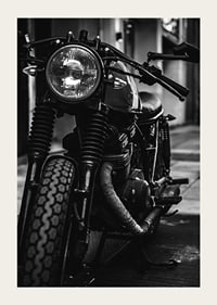 Black and white close-up of classic motorcycle in urban environment-5