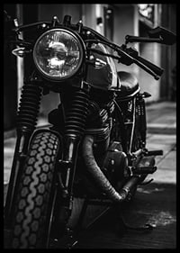 Black and white close-up of classic motorcycle in urban environment-6