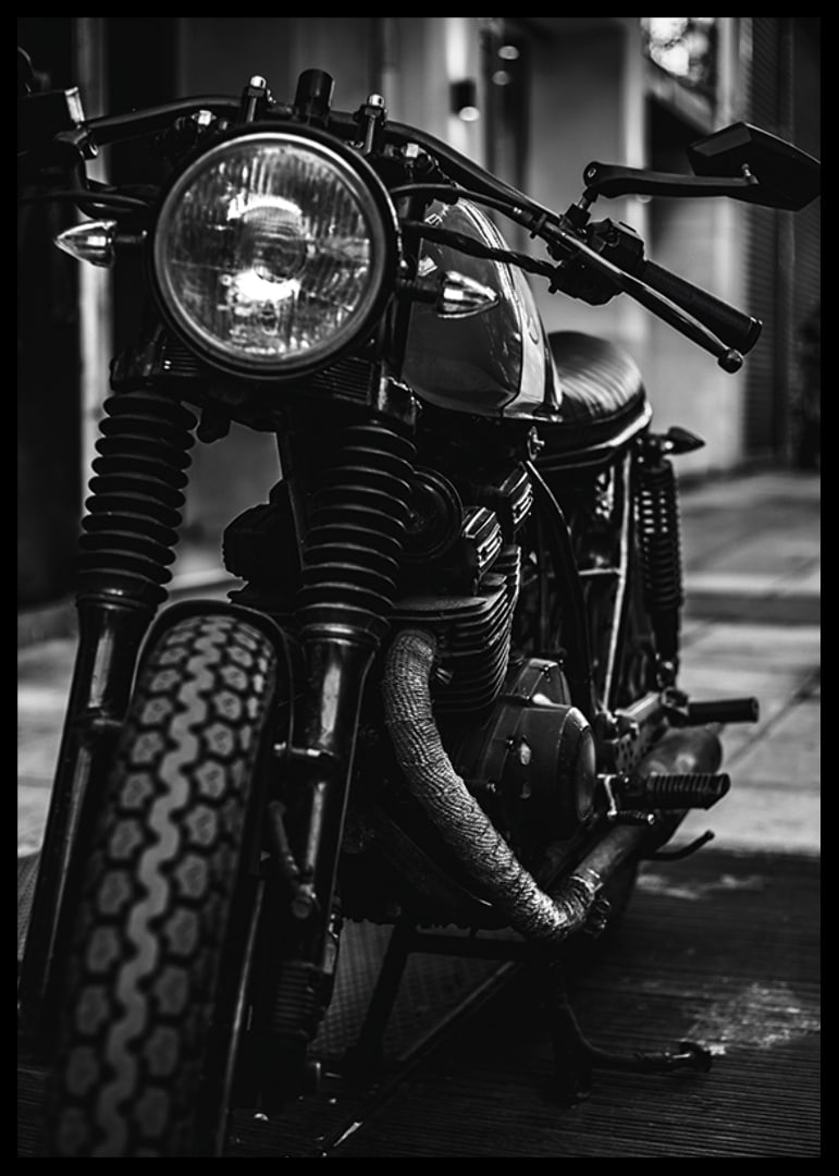 Black and white close-up of classic motorcycle in urban environment-12