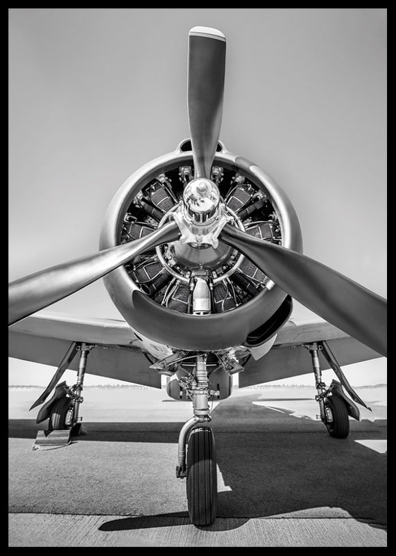 Black and white photograph of old propeller plane from the front-12