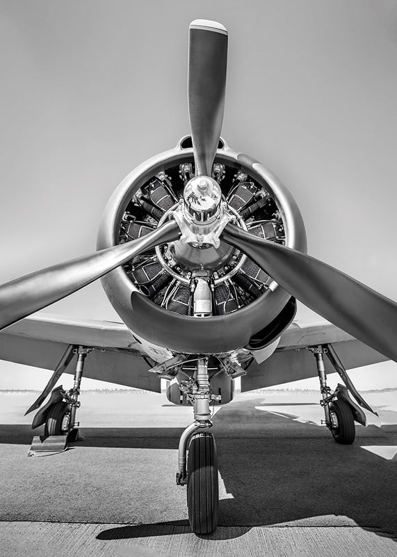 Black and white photograph of old propeller plane from the front-12