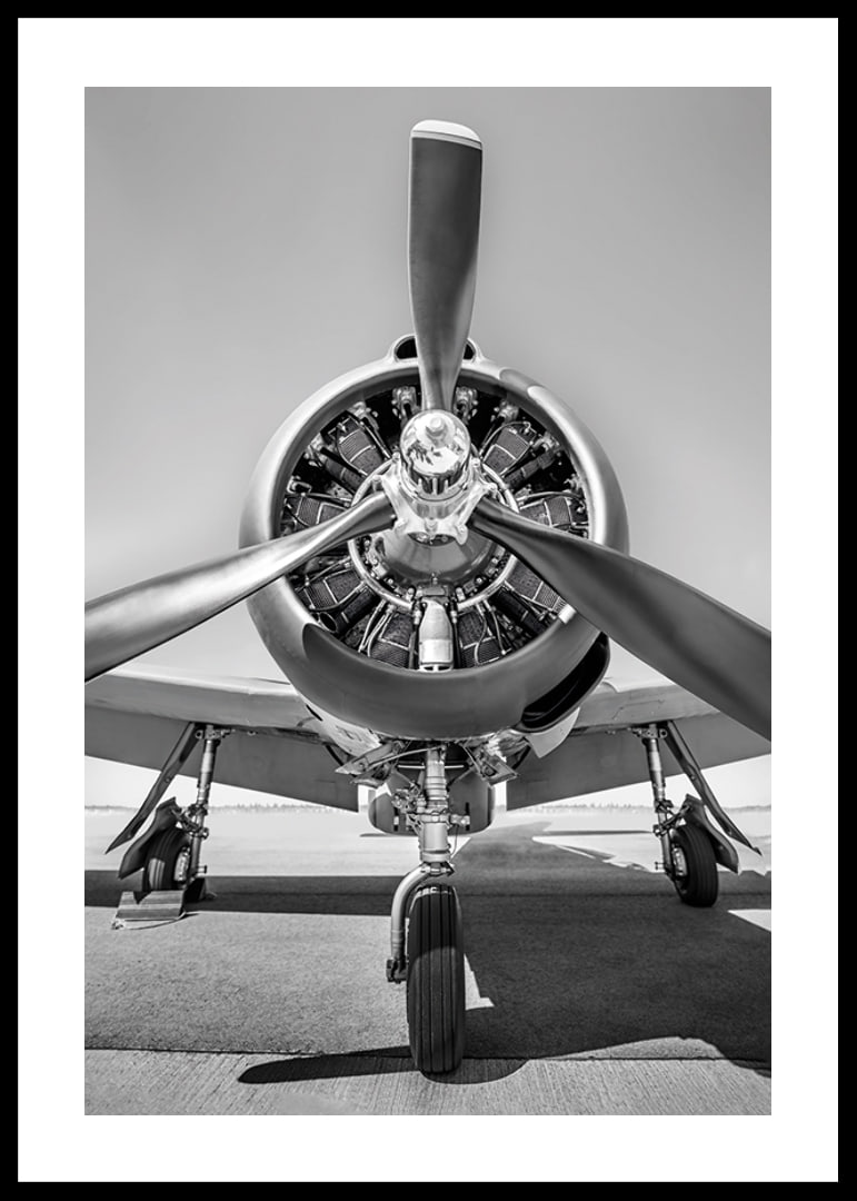 Black and white photograph of old propeller plane from the front-12