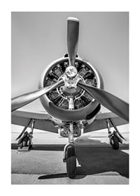 Black and white photograph of old propeller plane from the front-1