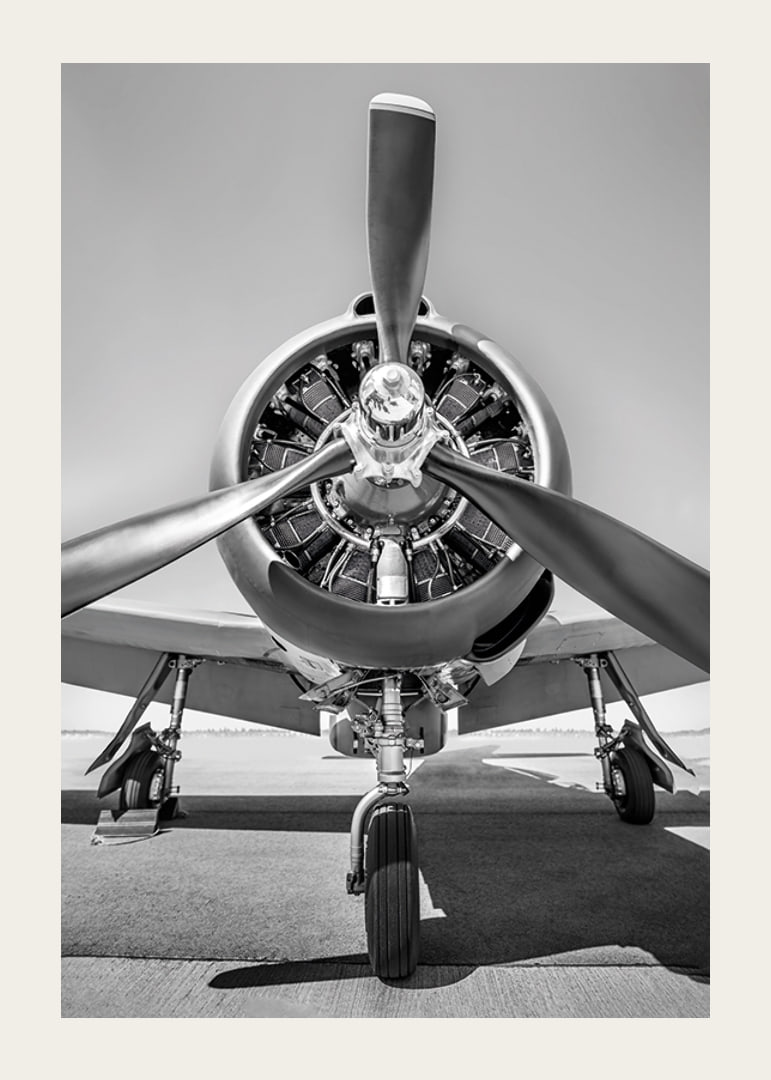 Black and white photograph of old propeller plane from the front-12
